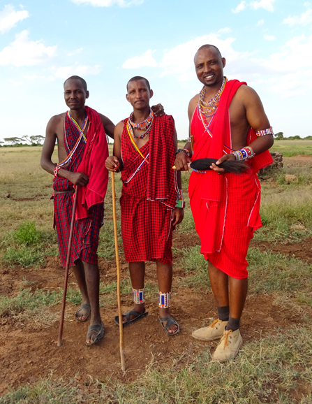 From right, guide Eric Tembo with Jackson and Solomon local Maasai living in Amboseli National Park. Photograph by Christine Negroni.