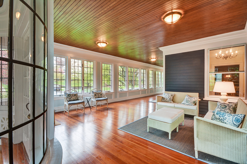 An additional view of the porch. Courtesy Julia B. Fee Sotheby's International Realty.