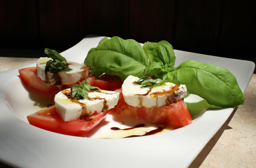 Beefsteak tomatoes, fresh mozzarella and basil with a balsamic drizzle. Photograph courtesy Taberna Restaurant Tapas & Wine Bar.