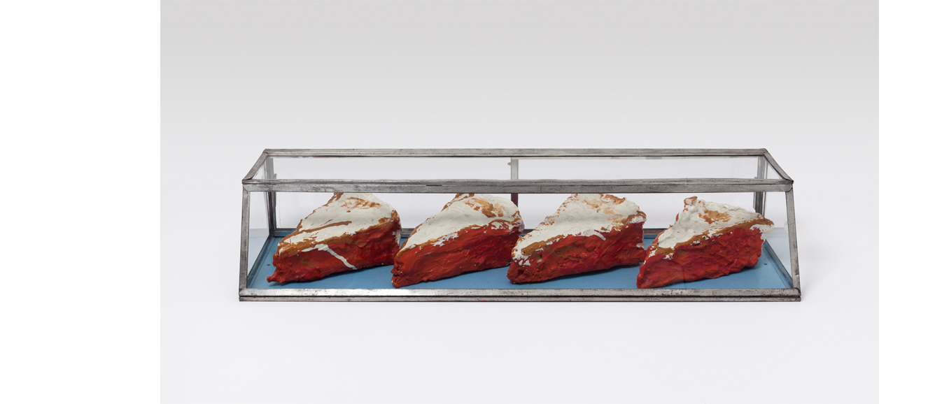 Claes Oldenburg’s “Four Pies in a Glass Case” (1961), muslin soaked in plaster over chicken-wire, painted with enamel in glass case: 5 3/4 by 30 by 9 inches, 13.3 by 76.2 by 23 centimeters. Each pie is approximately 2 1/2 by 8 by 5 inches. Copyright Claes Oldenburg. Courtesy Paula Cooper Gallery, New York. Photograph by Steven Probert.