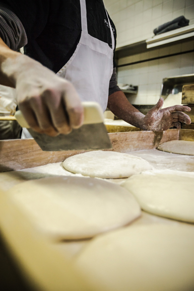 The pizza dough is prepared for baking. Photograph courtesy Thomas McGovern Photography.
