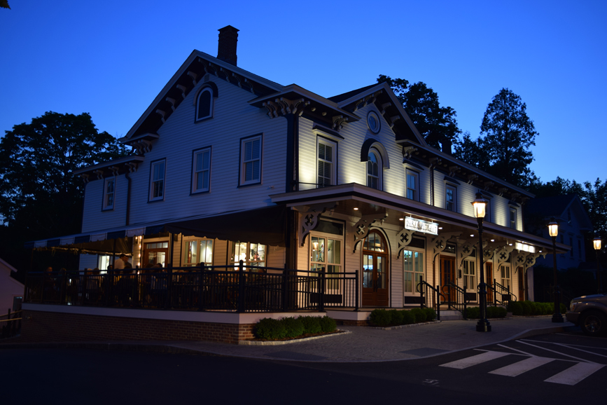 Dere Street Restaurant’s lit exterior at the corner of Main and West streets in Newtown. Photograph by Aleesia Forni.