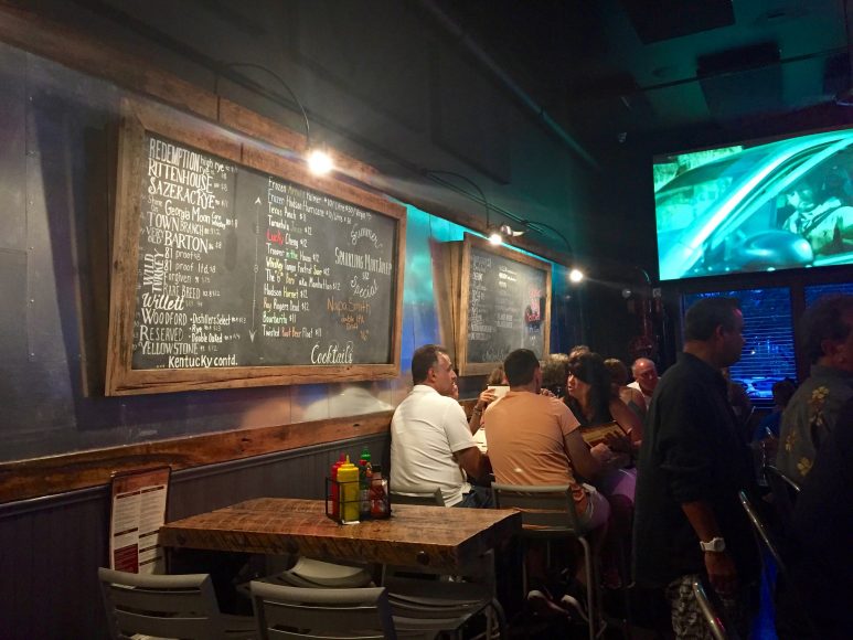 Drink selections are displayed on chalkboards lining the walls of Buns-N-Bourbon.