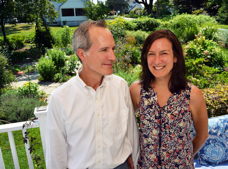 Pete and Kate D. Spain on their Bridgeport deck, which overlooks the expansive gardens that fuel Kate’s design work. Photograph by Bob Rozycki.