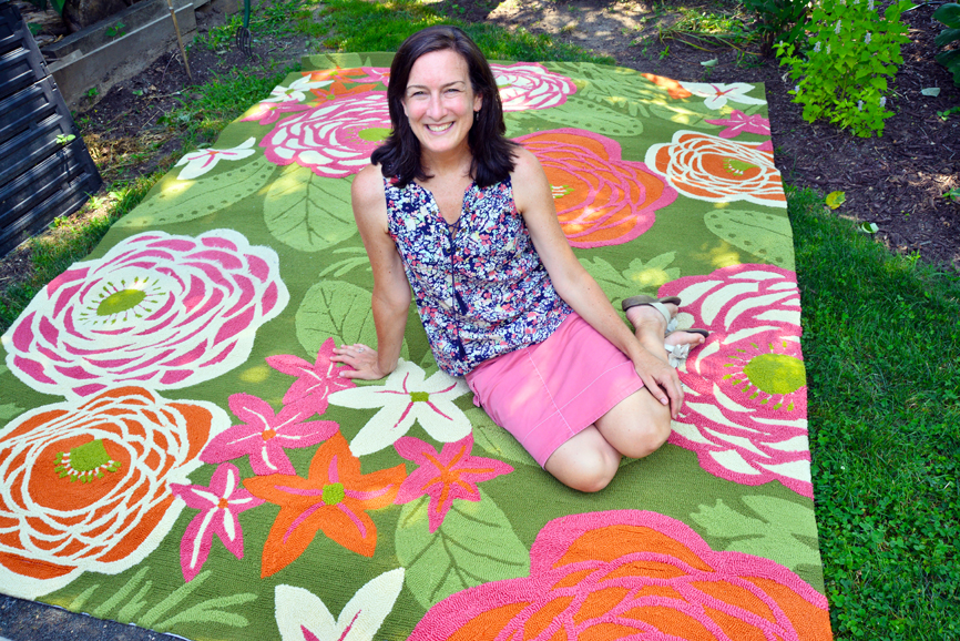 Kate D. Spain in her Bridgeport garden, on a rug of her own design. Photograph by Bob Rozycki.