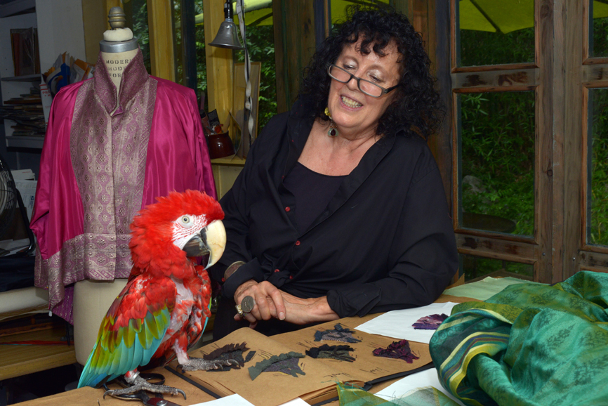 Jane Wilson-Marquis with her Macaw, Thor, in her Putnam Valley workshop. Photograph by Bob Rozycki.