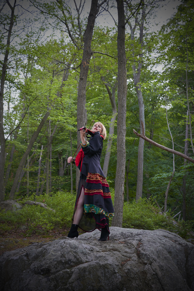 Classical-rock violinist Daisy Jopling wearing a one-of-a-kind coat designed by Jane Wilson-Marquis. Courtesy Jane Wilson-Marquis.