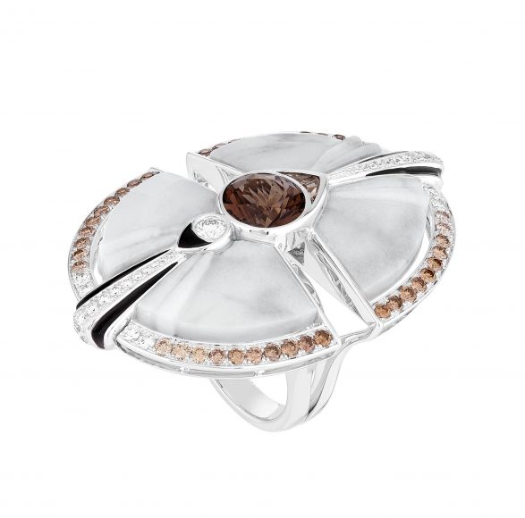 White gold paved with dozens of diamonds, champagne diamonds, smoky quartz, marble motifs and black lacquer highlight The Mockingbird ring from Lalique’s Vertiges collection. Courtesy Lalique. 
