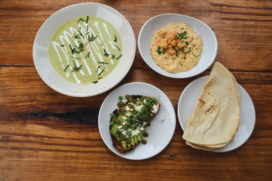 An array of appetizers includes gazpacho blanco, hummus, pita and an avocado crostini. Photograph by Aleesia Forni.