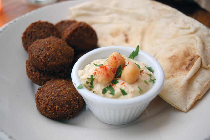 The freshly fried falafel is served with hummus and a Lebanese pita. Photograph by Aleesia Forni.