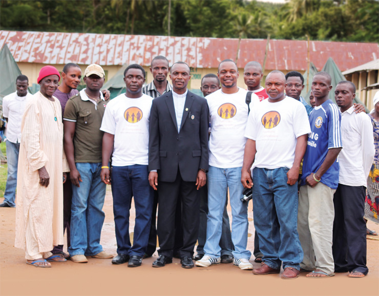 The Rev. Philip P. Tah (center) with the men of his village. Photograph courtesy the Rev. Philp P. Tah.