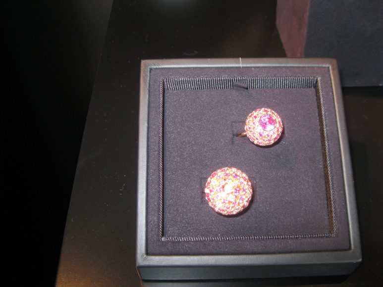 Glittering pink sapphire and diamond rings beckon you to try them on.
