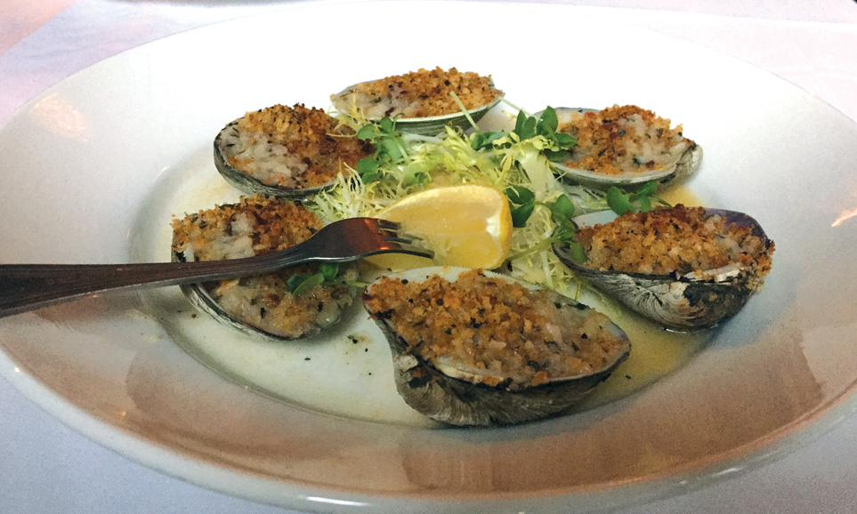 Baked clams are topped with breadcrumbs and parsley on one of Jordan Hall's small plates. Photograph by Aleesia Forni.