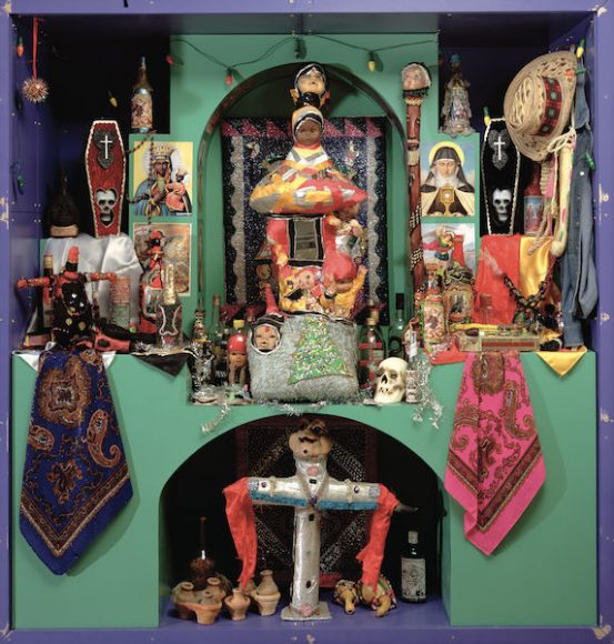 A Haitian voodoo altar, bringing together a wide range of symbolic objects and religious imagery. All Haitian voodoo altars feature a cross, which stands not only for the divine but also for the crossroads.	
	Haitian School, voodoo altar. Mixed media.
	Horniman Museum, London/ Photo Heini Schneebeli/ Bridgeman Images
