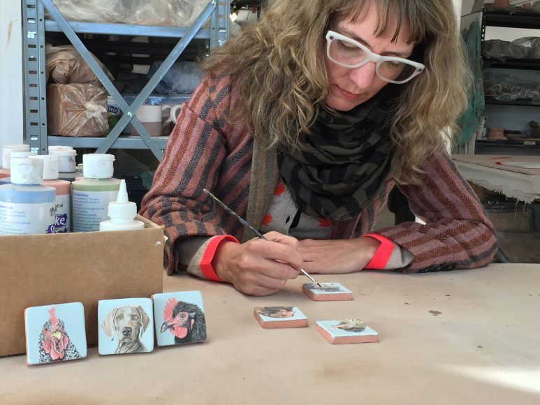 Participants in the Garrison Art Center 2016 Holiday Pottery Show & Sale include artist Chantelle Norton, shown here working on her ceramic tiles. Photograph by Carinda Swann courtesy Garrison Art Center.