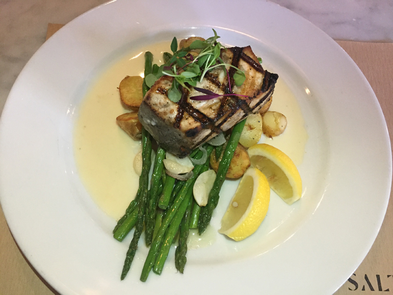 East Coast swordfish joins a plate of fingerling potatoes and asparagus with a beurre blanc sauce. Photograph by Aleesia Forni.
