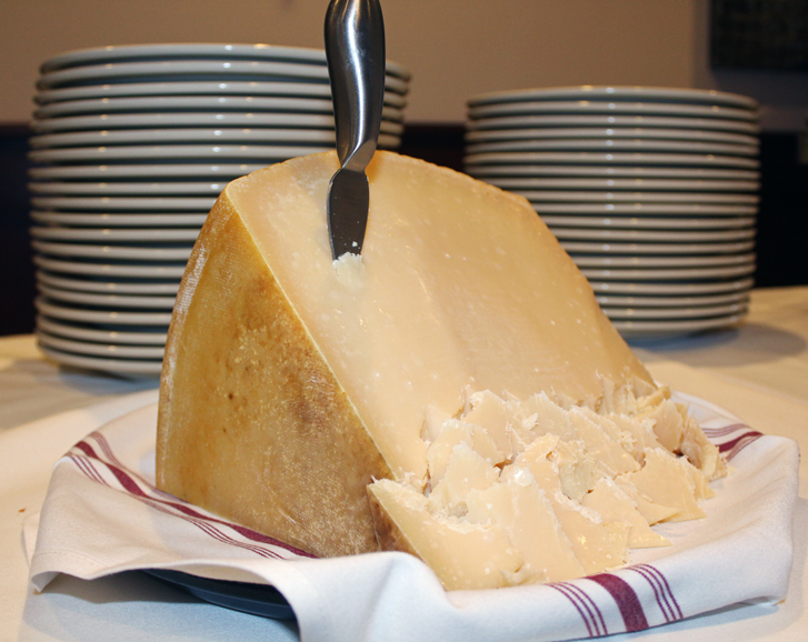 Guests helped themselves to a Parmesan cheese block. Photograph by Aleesia Forni. 