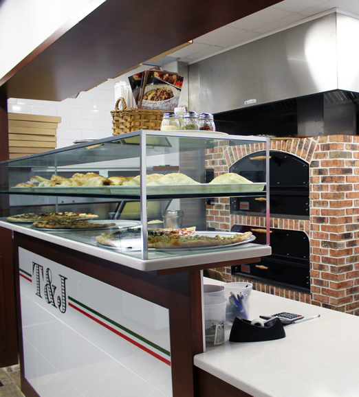 The front of T&J's is a traditional pizzeria setup, while the back offers a sit-down area.