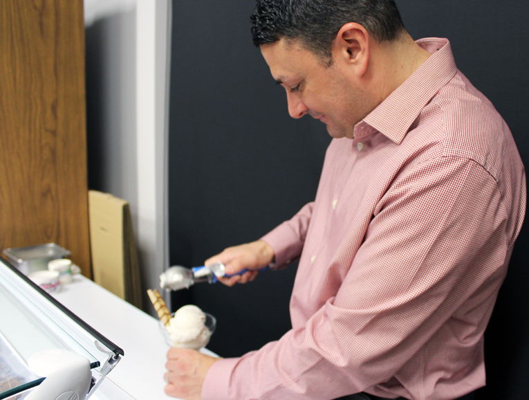 Co-owner John Ruggiero makes an ice cream for one of his guests. Photograph by Aleesia Forni.