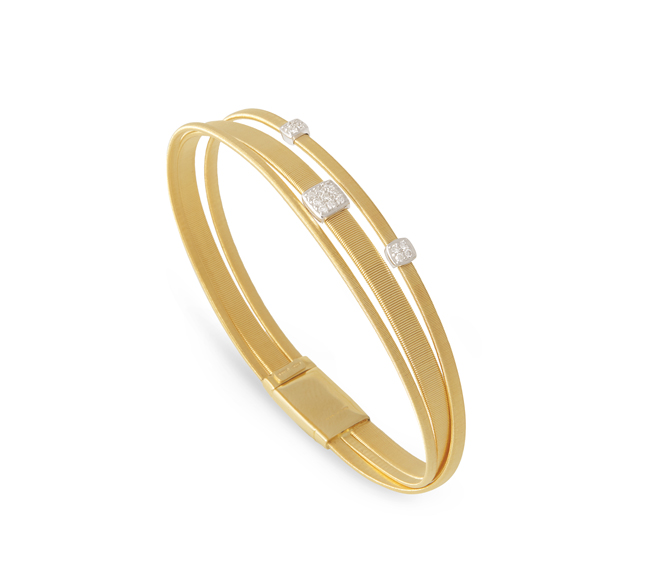 Masai bracelet hand-coiled in 18-karat yellow gold with pave diamonds, $4,280. Photograph courtesy Marco Bicego.