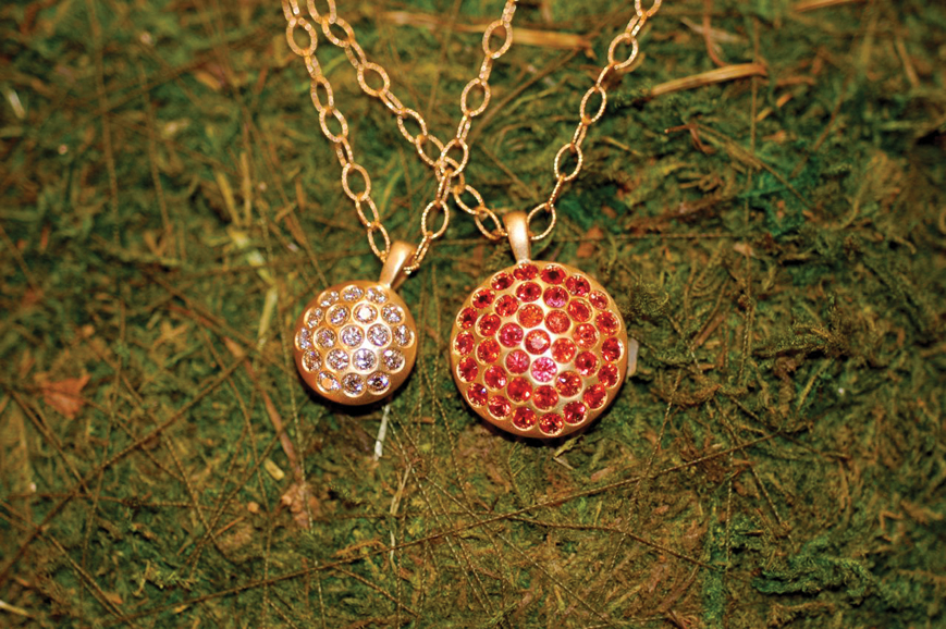 Burnished Diamond and Sapphire Pendants in 18-karat, burnished yellow gold. The smaller pendant features 1.00 carat of diamonds and the larger pendant boasts 2.25 carats of orange-pink sapphires. Diamond pendant, $1,600 and sapphire pendant, $3,200. Photograph courtesy Isabel Dunay.