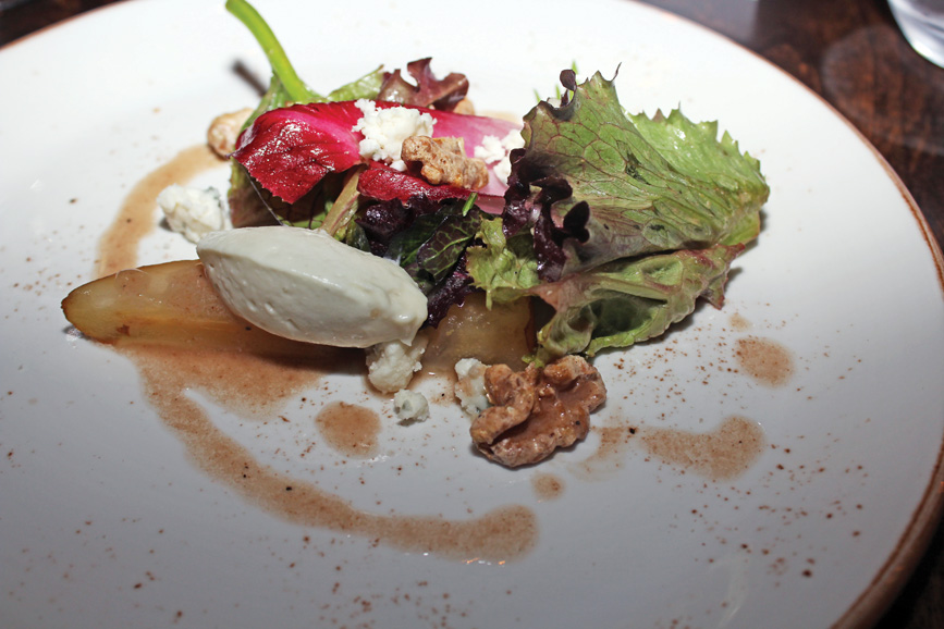 Compressed pear salad is served with local greens, blue cheese and walnut dressing. Photograph by Aleesia Forni. 
