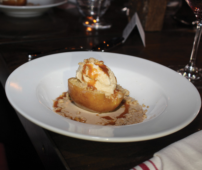 A baked Gala apple is drizzled with an oat-walnut crumble. Photograph by Aleesia Forni.