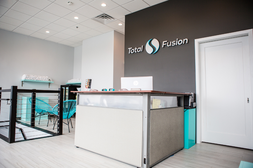 The reception area of TotalFusion Studios, which often features merchandise, from jewelry to clothing and protein shakes and snacks, that are handmade and/or sold by the studio's trainers. Photograph by Starlight Studioz.