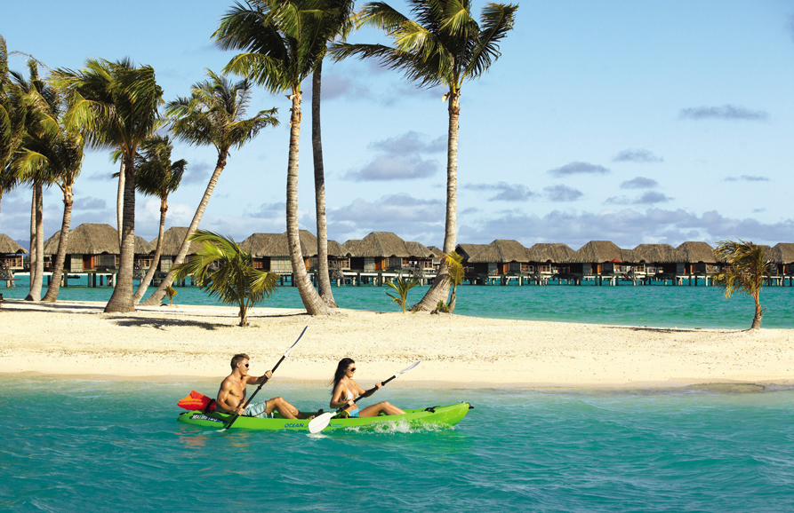 Kayaking at Four Seasons Resort Bora Bora. Photograph by John Russo.