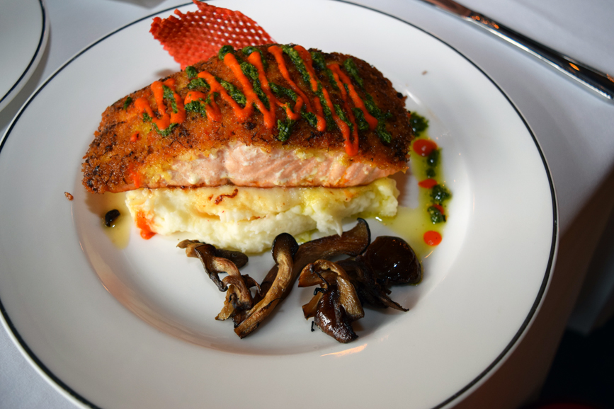 A main course of salmon sits atop a serving of creamy mashed potatoes. Photograph by Aleesia Forni.
