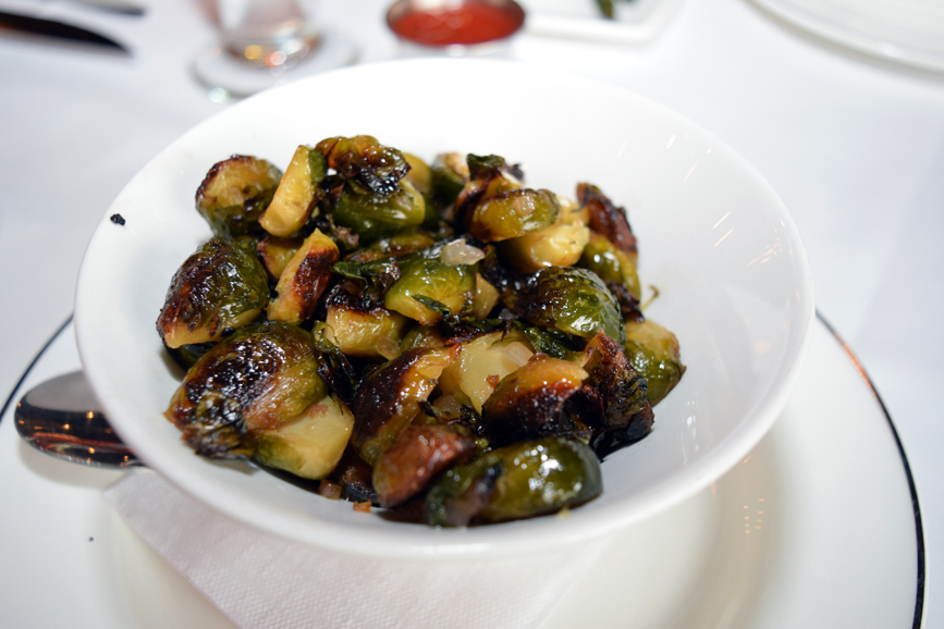 A heaping bowl of roasted brussel sprouts are pleasantly charred. Photograph by Aleesia Forni.