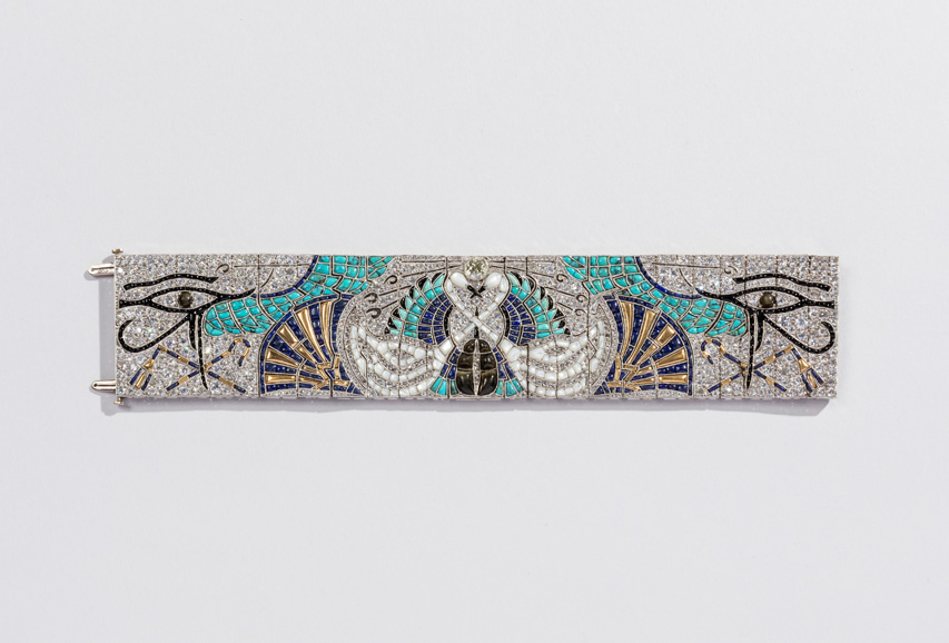 Egyptian Bracelet, ca. 1925; Produced by Lacloche Frères (Paris, France); Diamonds, turquoise, sapphires, mother-of-pearl, onyx, black pearls, smoky quartz, tourmaline, gold, platinum; 17.9 × 4 cm (7 1/16 × 1 9/16 in.); Private Collection; Photo Credit: Matt Flynn.