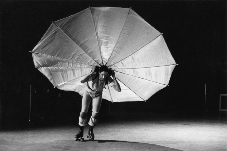 Peter Moore. Photograph of Robert Rauschenberg’s “Pelican” (1963) as performed in a former CBS television studio, New York, during the First New York Theater Rally, May 1965. Photograph © Barbara Moore/Licensed by VAGA, New York, NY. Courtesy Paula Cooper Gallery, New York. © 2016 Robert 