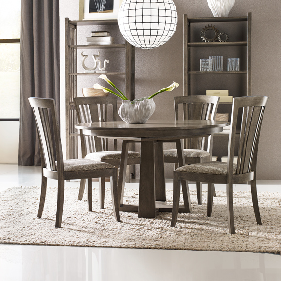 The Studio by Stickley Modern Loft Round Dining Table, finished here in Fieldstone, takes entertaining to a new level. Photograph courtesy of L. & J.G. Stickley, Inc.