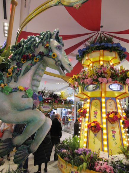 Following tradition, an elaborate main entrance greeted visitors to the annual flower show at the Macy’s Herald Square flagship in Manhattan. Photograph by Mary Shustack.