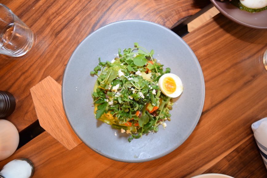 Diners can choose from an array of plates, including a salad that features carrots, sprouts and a boiled egg.