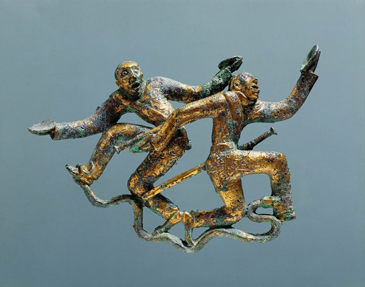 Ornament with Two Dancers from the Western Han dynasty (206 B.C.-A.D. 9), gilt bronze. Photograph courtesy Yunnan Provincial Museum.