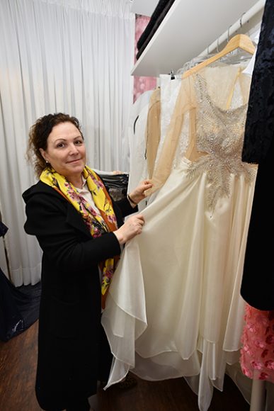 Shabani displays a custom-made bridal dress she created for a client. Photograph by Bob Rozycki.