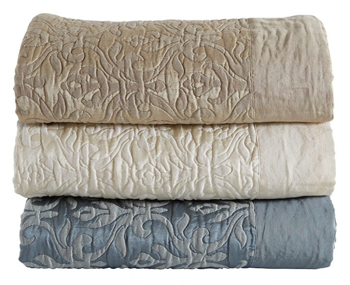 A mix of linen and silk in classic Frette jacquard in the pattern of intertwining leaves shown in beige, ivory and antique blue ($3,200 each). Photograph courtesy Frette.