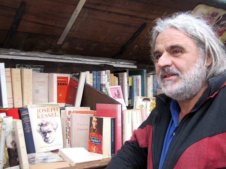 A bouquiniste (bookseller) along the banks of the Seine. Photograph courtesy Travellati Tours.