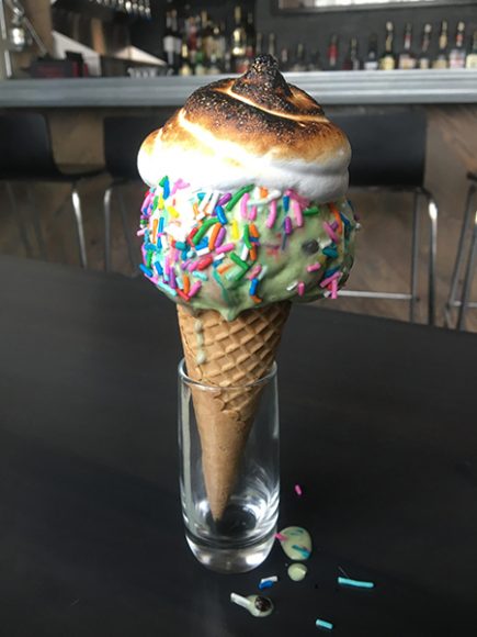 The Bona-style ice cream cone: a sugar cone topped with homemade mint chip ice cream, a dollop of delicately torched, homemade marshmallow sauce and a pinch of rainbow sprinkles. Photograph by Danielle Renda.