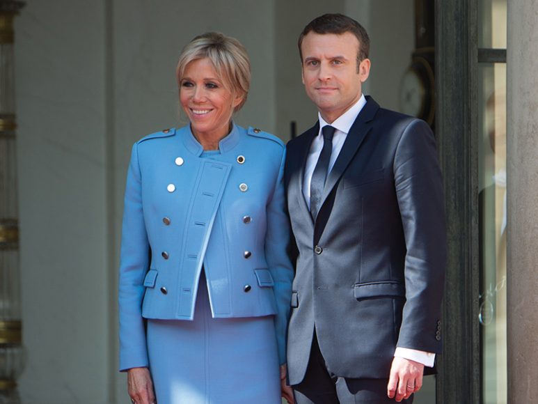 Newly elected French President Emmanuel Macron poses with his wife, Brigitte, at the Élysée Palace after the handover ceremony with his predecessor, François Hollande, on May 14 in Paris. Photograph by Patrick AVENTURIER/Gamma-Rapho via Getty Images.