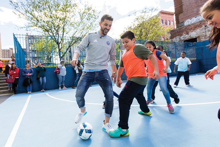 David Villa in the mix with students at P.S. 49 in the South Bronx.