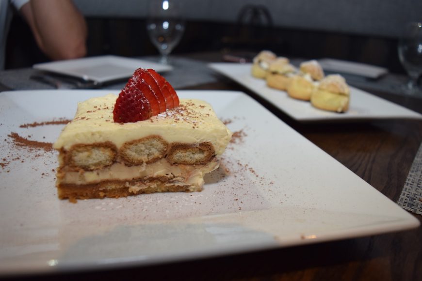 A dessert menu features tiramisu della casa and bignès with a hazelnut chocolate spread. 