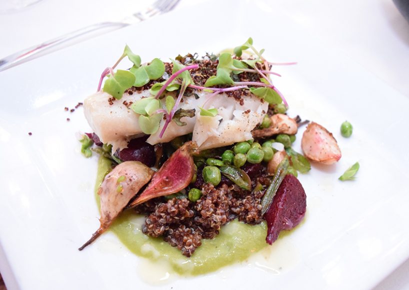 A filet of pollock and heirloom vegetables sit on a bed of quinoa. Photograph by Aleesia Forni.