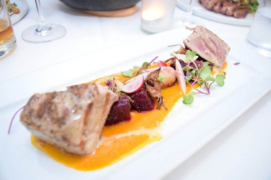Grilled tuna is joined by roasted carrots, radishes and beets and drizzled in beurre blanc. Photograph by Aleesia Forni.