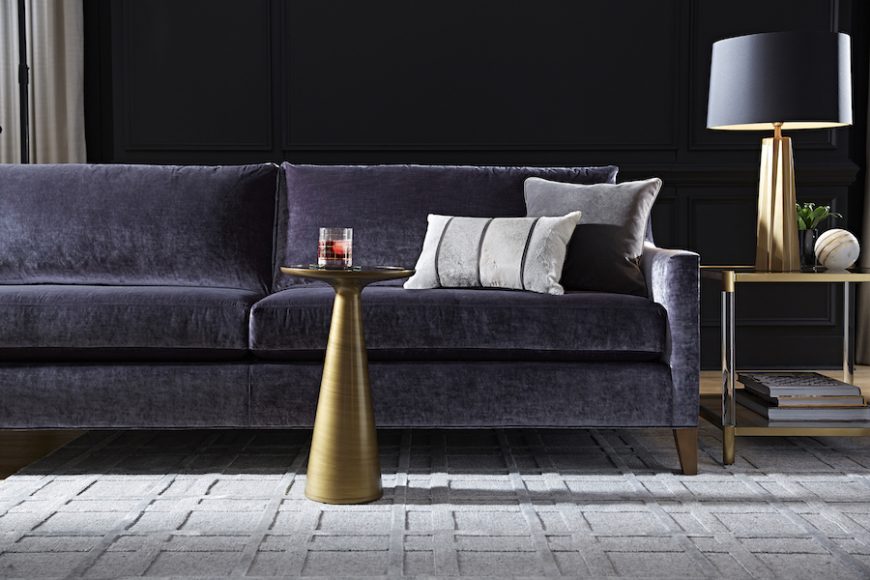 The New Traditional collection from Mitchell Gold + Bob Williams features the Gigi Sofa, Addie Pull-Up Table, Beverly Side Table, Tonio Table Lamp and Wiley Rug. Photograph courtesy Mitchell Gold + Bob Williams.