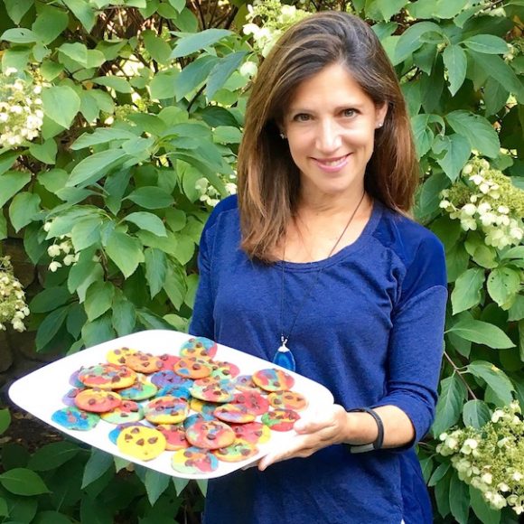 Julie Waxman, owner of Baked in Color, holds a platter of her delicious, multicolored cookies. Courtesy Baked in Color 