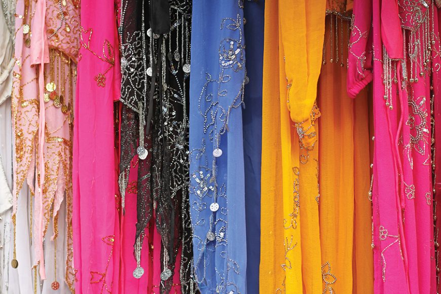 Colorful Islamic dresses with ducat decoration. Photograph courtesy dreamstime.