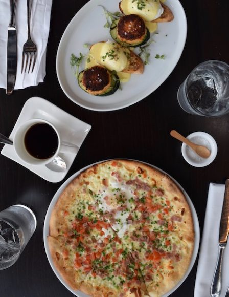 Brunch offerings include lump crab cake with poached eggs and a breakfast pizza